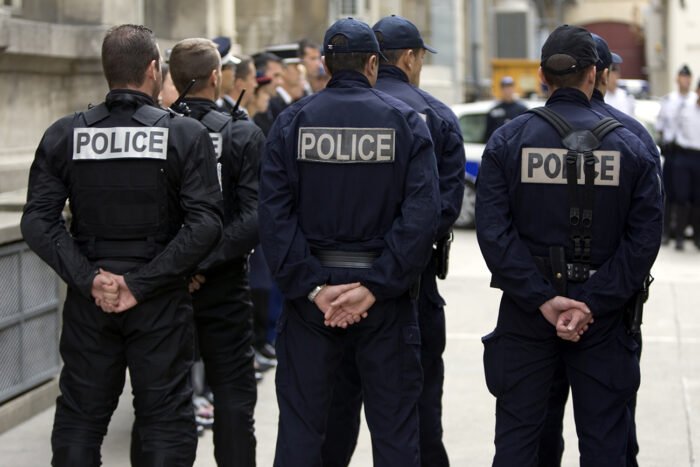 French Policemen Wait For The Arrival Of French Interior Minister Brice Hortefeux After A Meeting With French Police Forces In Paris